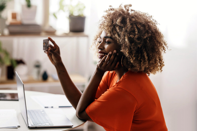 A client looking for a new card on her laptop